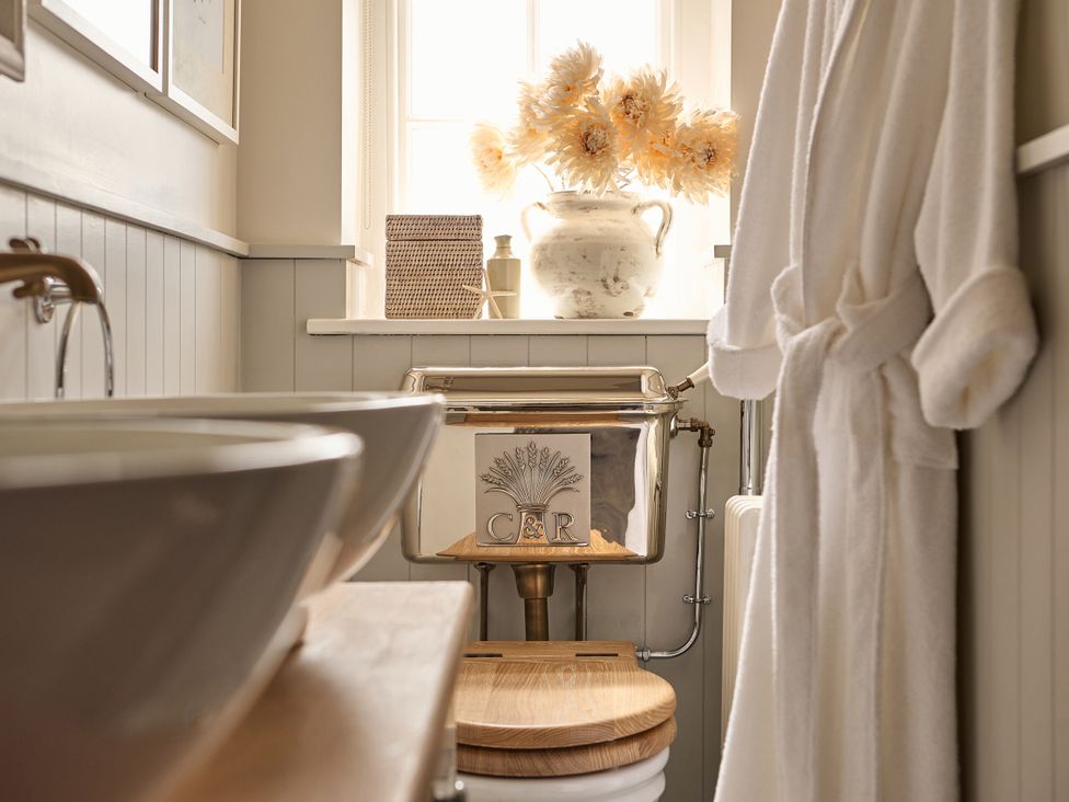 A bathroom with a sink and toilet at Castle Corner, The Georgian House in Ludlow