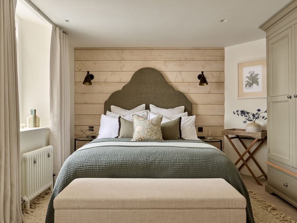 A bedroom with a bed and bedside table at Market View - The Georgian House, Ludlow