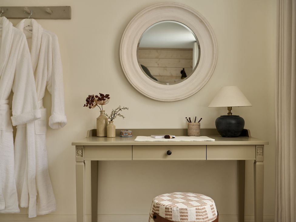A dressing room with a table and mirror at Market View - The Georgian House in Ludlow