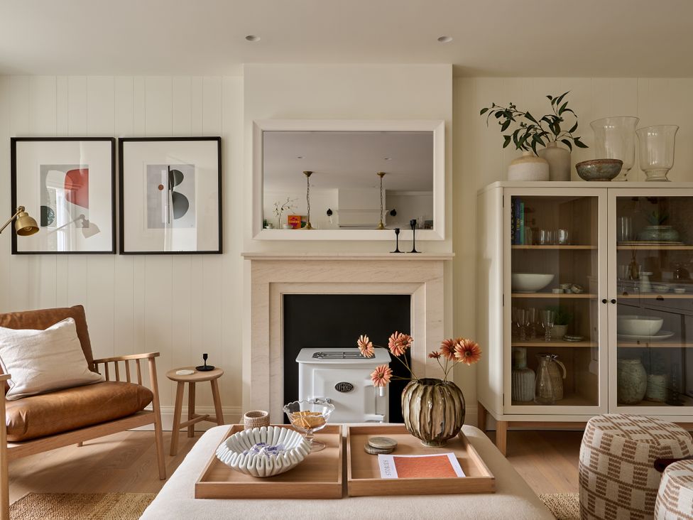 A living room with a fireplace and artwork at Stretton Hills Peaks - The Georgian House, Ludlow