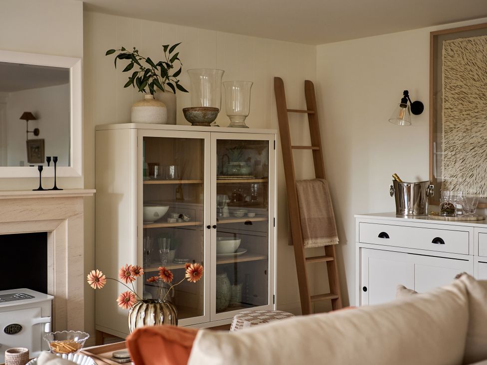 A living room with a cabinet and ladder at Stretton Hills Peaks - The Georgian House in Ludlow