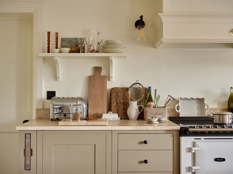 A kitchen with a countertop and various kitchen appliances at Stretton Hills Peaks - The Georgian House in Ludlow