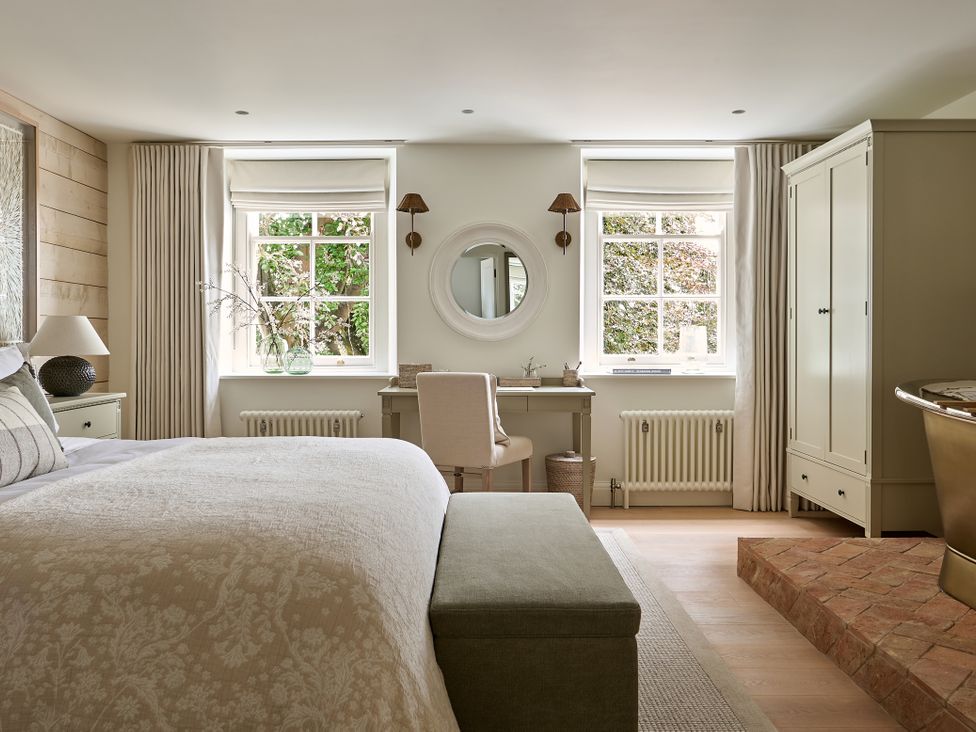 A bedroom with bed and desk at Stretton Hills Peaks - The Georgian House in Ludlow