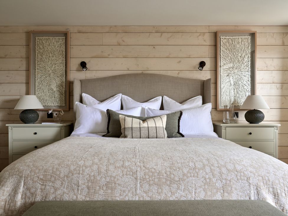 A bedroom with a bed and two nightstands at Stretton Hills Peaks - The Georgian House Ludlow