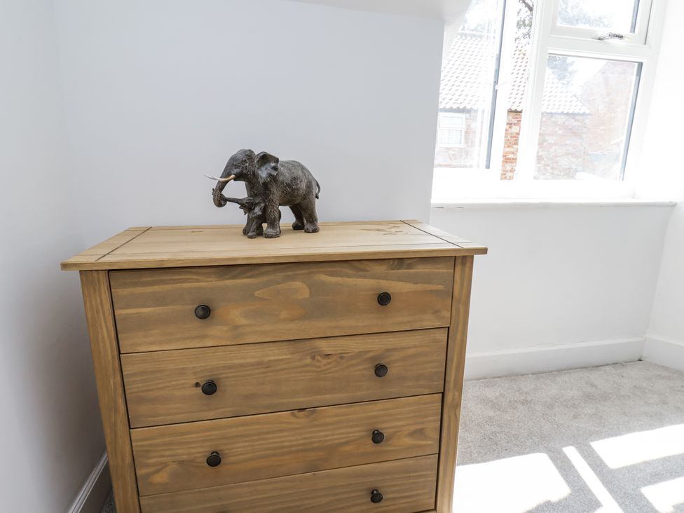 A chest of drawers with an elephant figurine at Hemdin Cottage in Thornton Dale