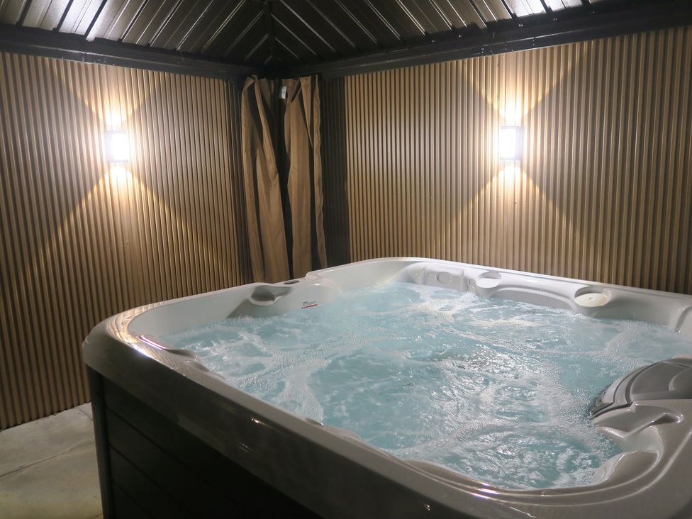 A hot tub in a spa room at Seabreeze in Llandudno