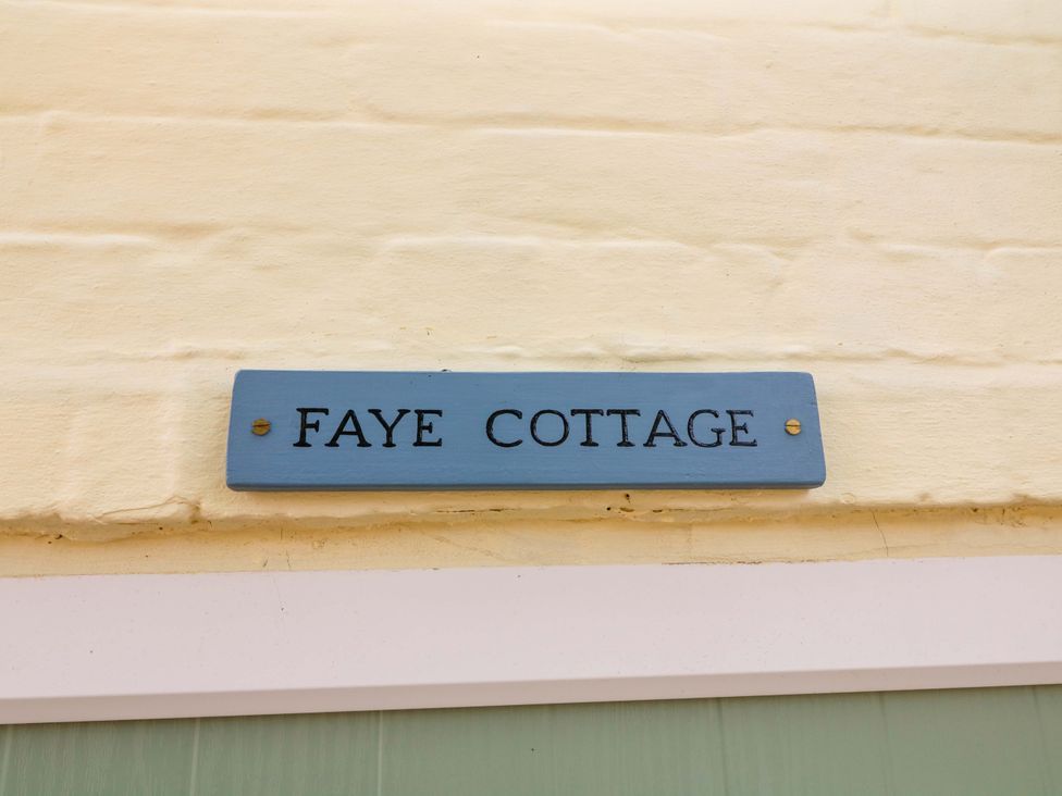 A sign displaying Faye Cottage at 37 East Lane, Mansfield