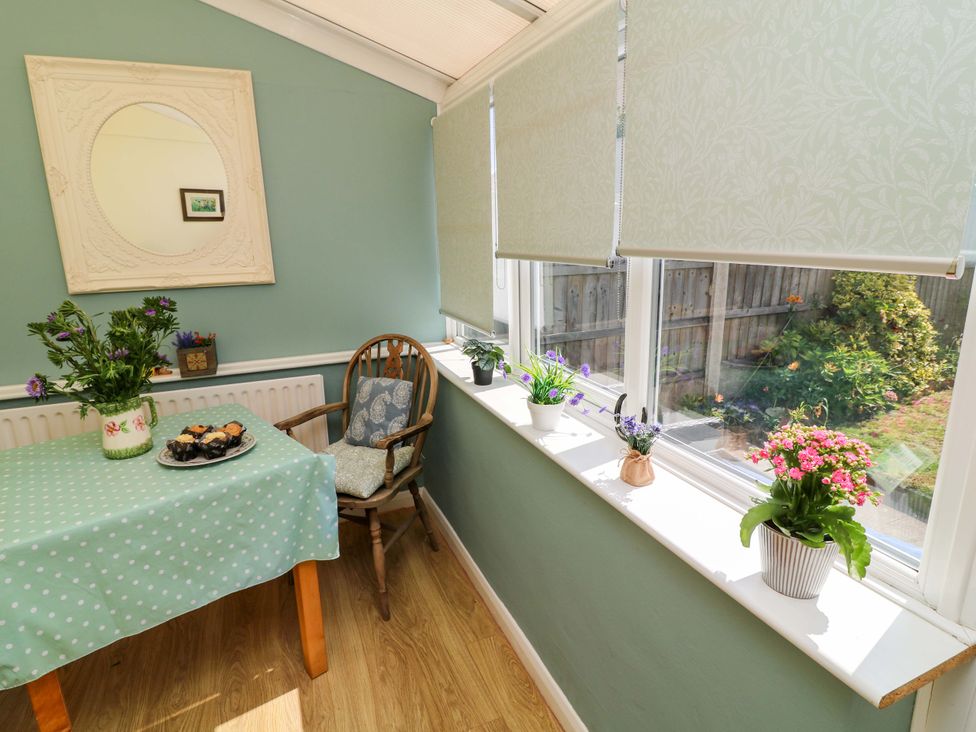 A dining room with a table and chair at 37 East Lane Mansfield