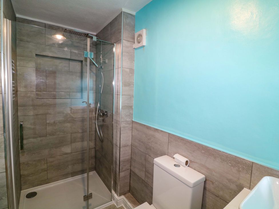 A bathroom with a shower and toilet at 37 East Lane in Mansfield