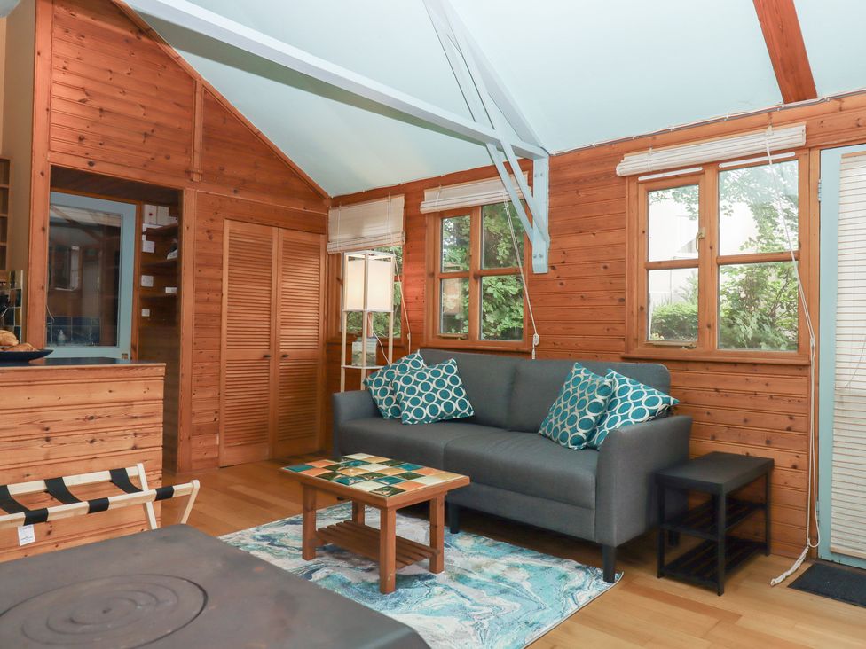 A living room with a sofa and coffee table at The Boat House in Ashprington