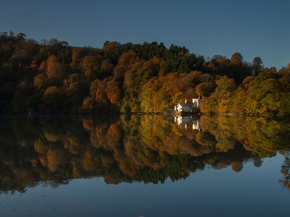A house near water surrounded by trees at The Boat House Ashprington