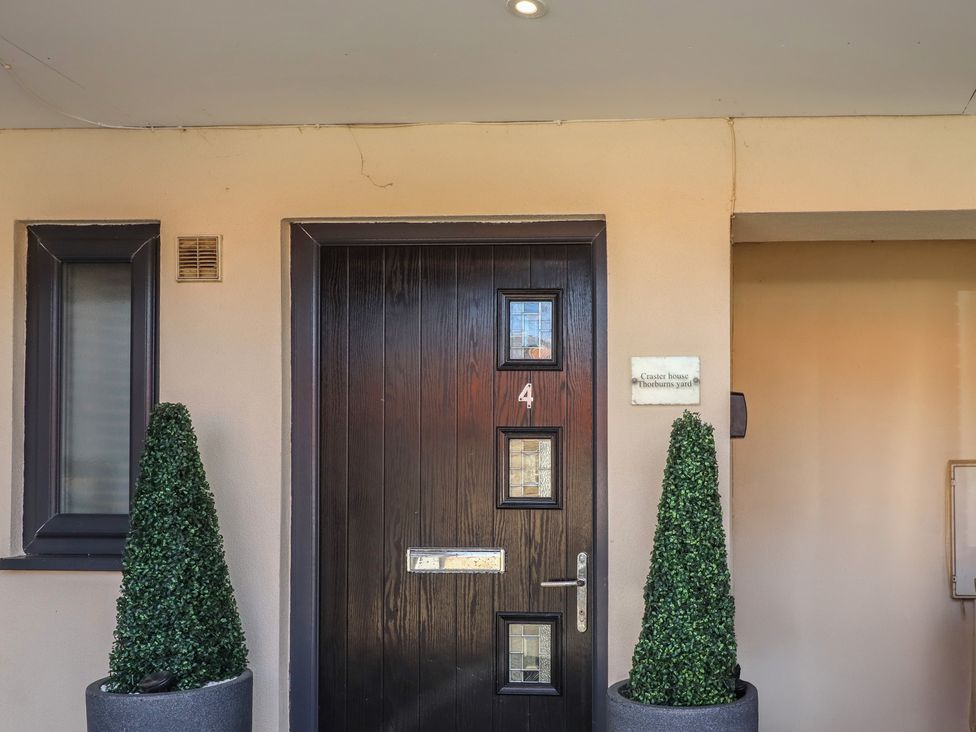 A door with house number 4 at Craster House in Seahouses