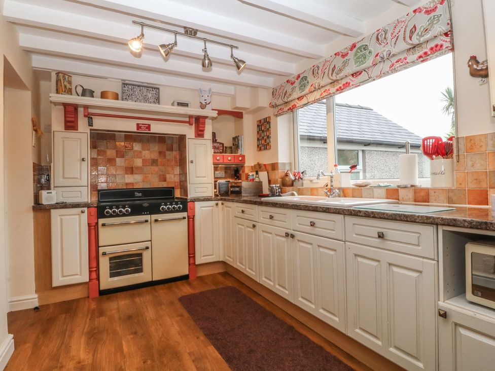 A kitchen with cabinets and an oven at Rhianfa in Llanfairpwllgwyngyll