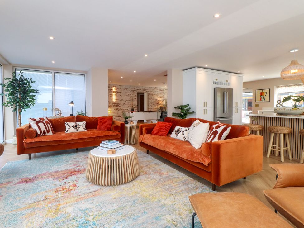 A living room with sofas and a coffee table at Ardwyn in Rhosneigr