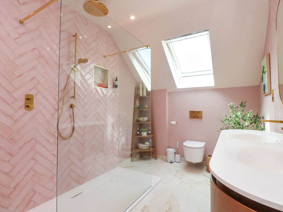 A bathroom with a shower and toilet at Ardwyn in Rhosneigr