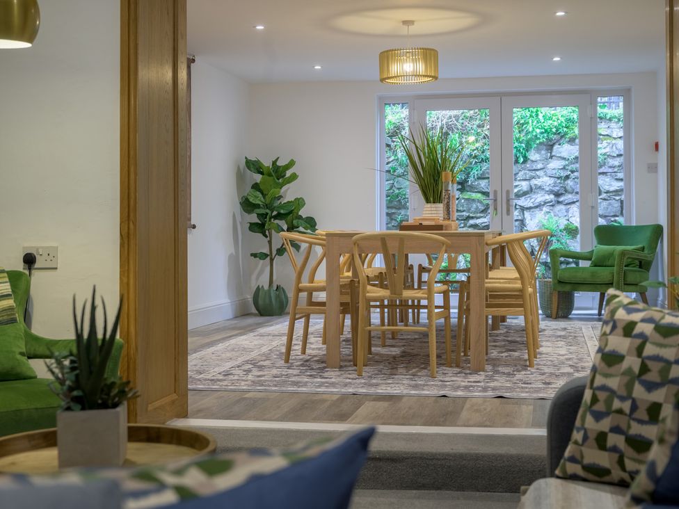 A dining room with a table and chairs at Moss Crag in Glenridding