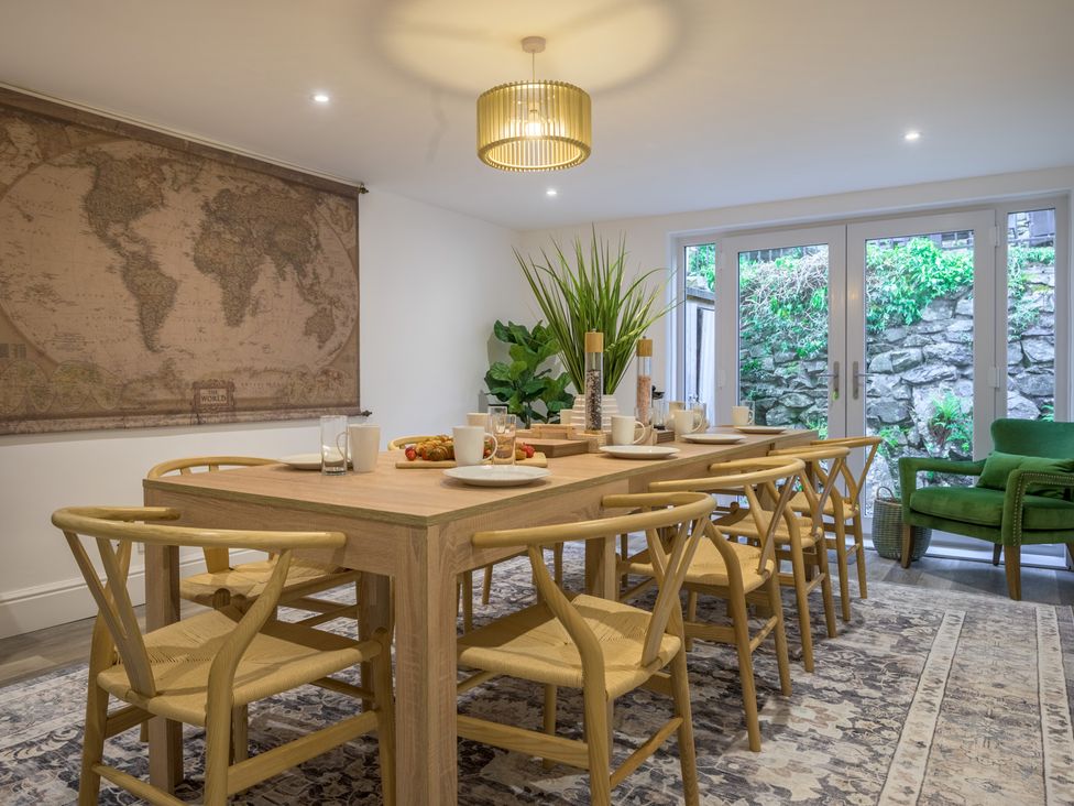 A dining room with a large table and chairs at Moss Crag in Glenridding