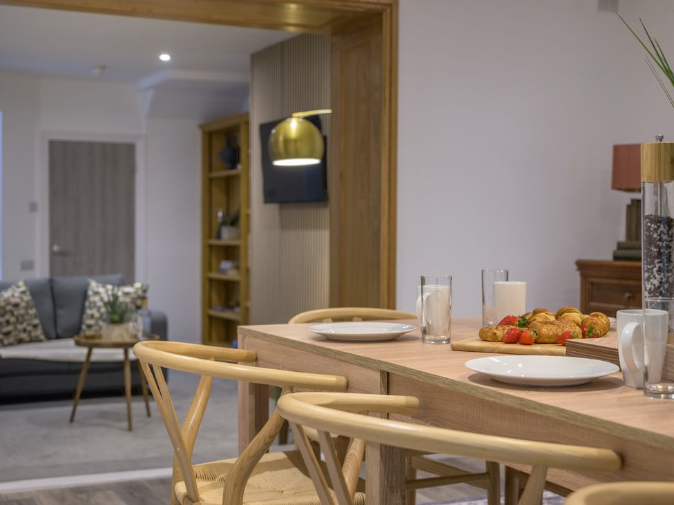 A dining room with a table set for breakfast at Moss Crag in Glenridding