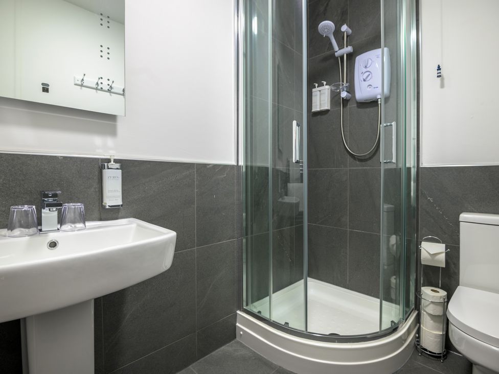 A bathroom with a shower and sink at Moss Crag in Glenridding
