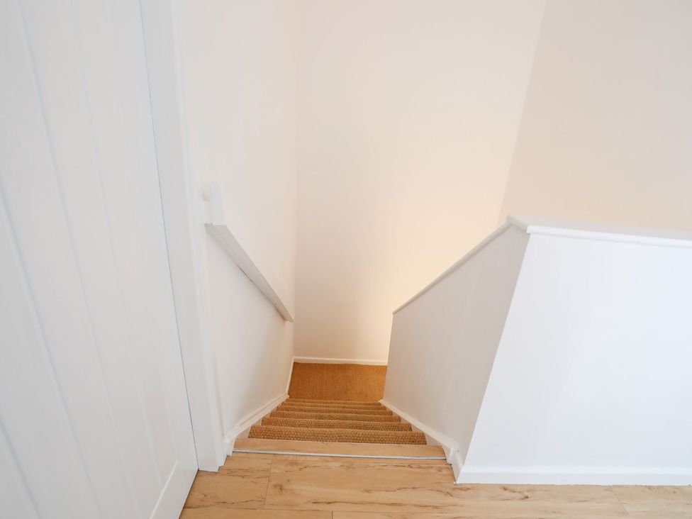 Stairs leading down with a handrail at 15 Llwyn Gwalch Estate Pwllheli
