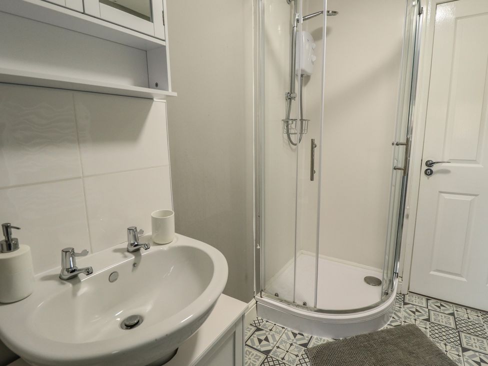 A bathroom with a sink and shower at Southfields Annex in Little Carlton near Louth