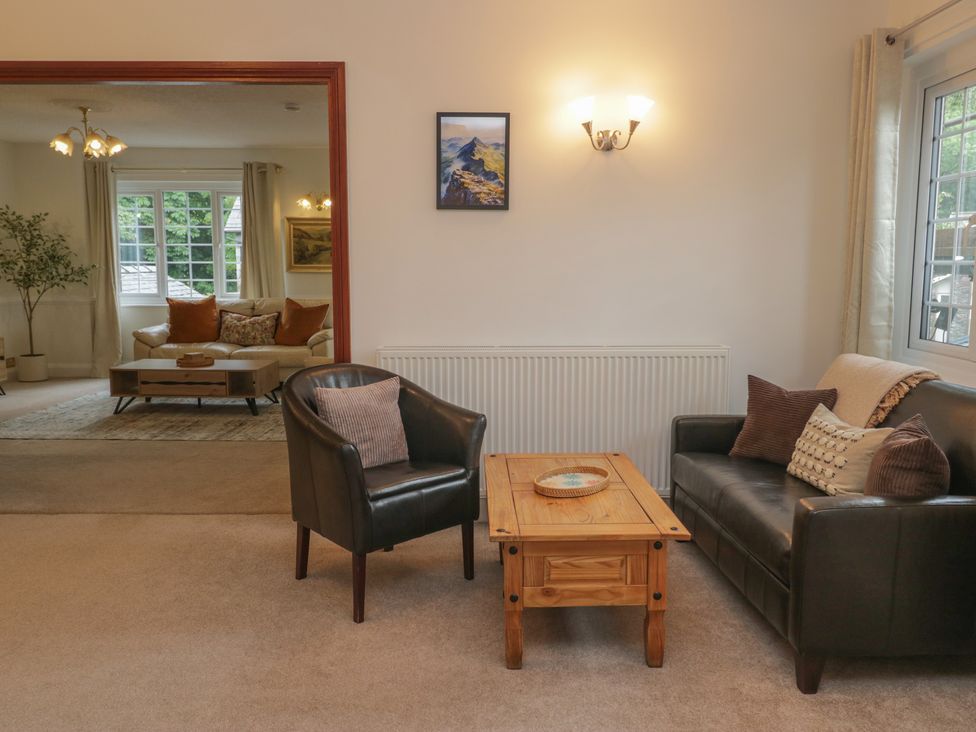 A living room with a sofa and armchair in Cumbria house