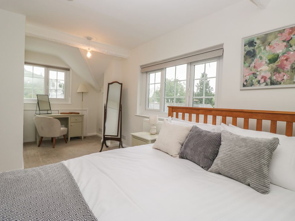 A bedroom with a bed and a desk at Cumbria house