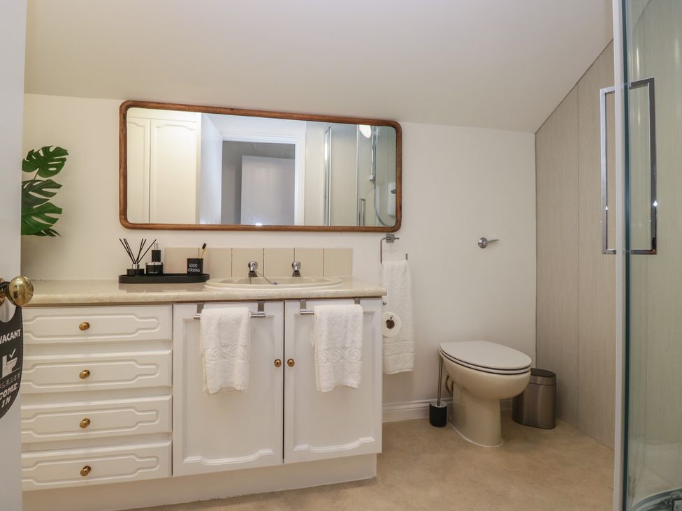 A bathroom with a sink and a toilet at Cumbria house
