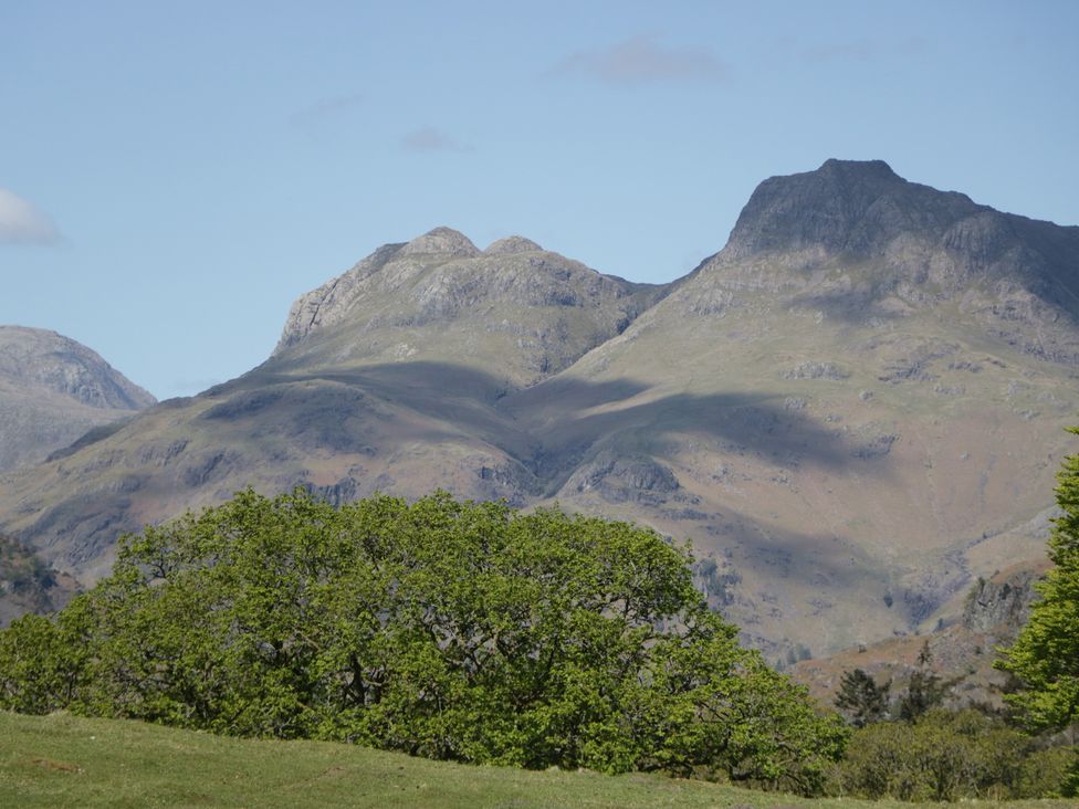 Mountains and greenery in a landscape with a clear sky at Cumbria house