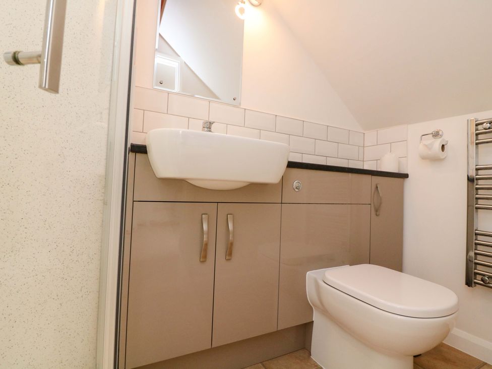 A bathroom with a sink and toilet at Surf View in Hope Cove