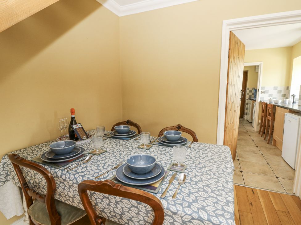 A dining room with a table set for meals at Waun Yscir Merthyr Cynog near Brecon