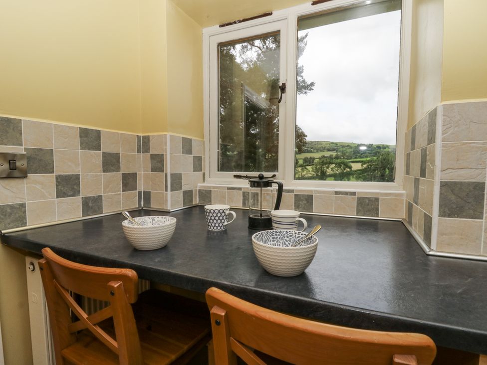 A kitchen with a window, bowls and a coffee pot at Waun Yscir, Merthyr Cynog near Brecon
