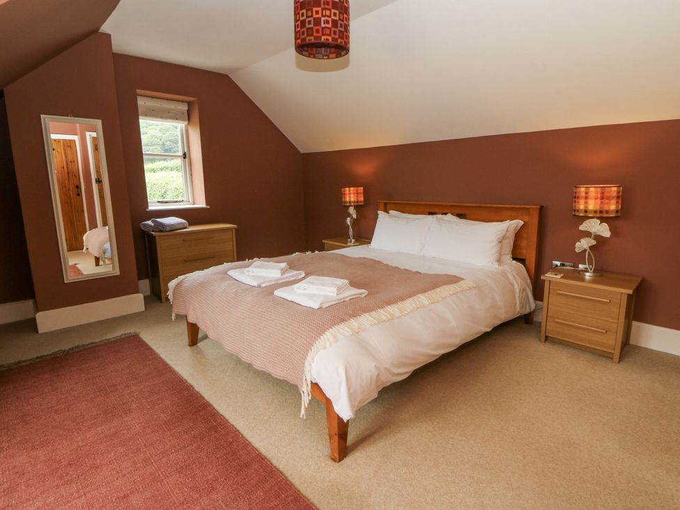 A bedroom with a bed and side tables at Waun Yscir near Brecon
