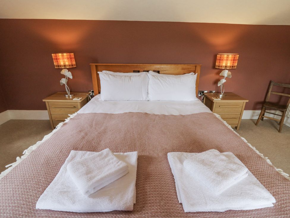 A bedroom with a bed and lamps at Waun Yscir near Brecon
