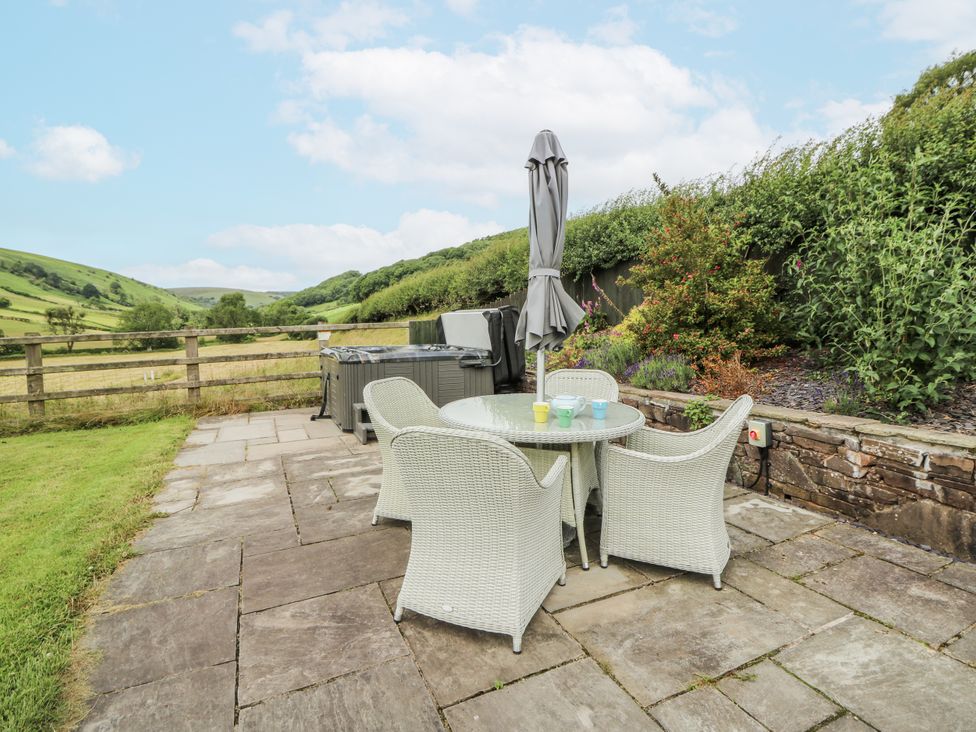 An outdoor area with a table and chairs at Waun Yscir, Merthyr Cynog near Brecon
