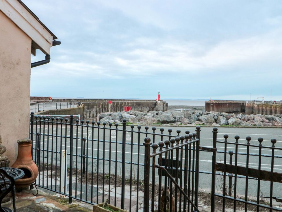 A view of the pier and lighthouse from a property at Sammy Hakes Cottage