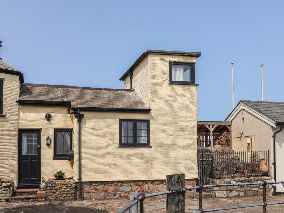 A house exterior with windows and a door at Sammy Hakes Cottage Watchet