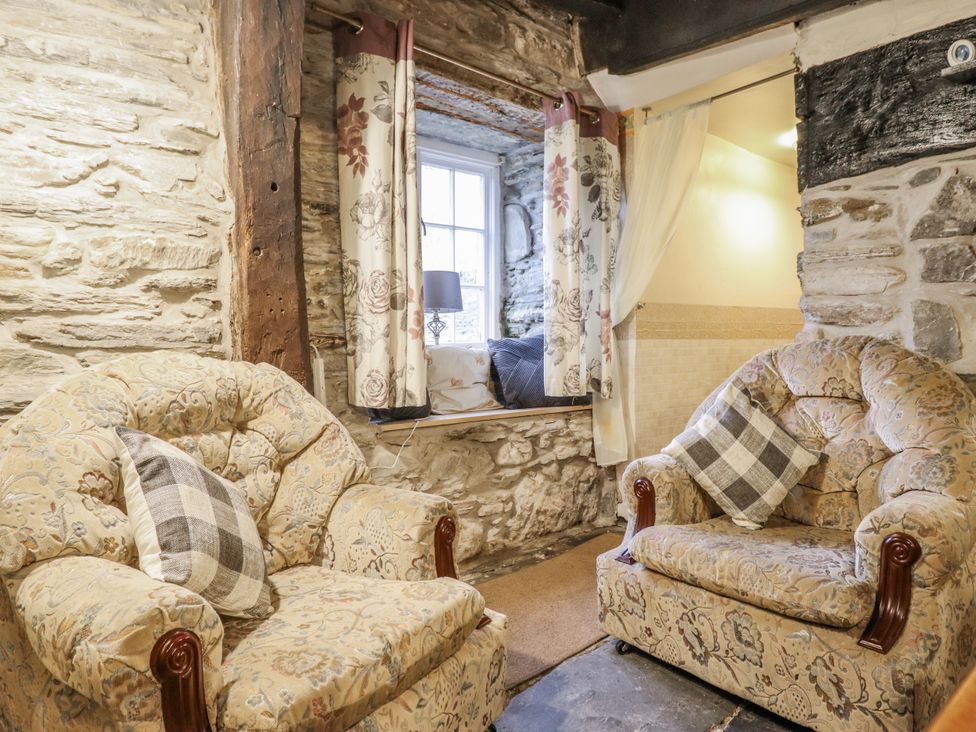 A living room with two chairs and a window at Cynfal Fawr Near Blaenau Ffestiniog
