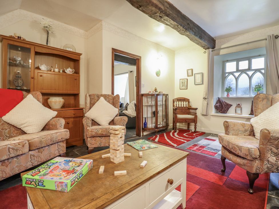 A living room with a coffee table and two armchairs at Cynfal Fawr Near Blaenau Ffestiniog