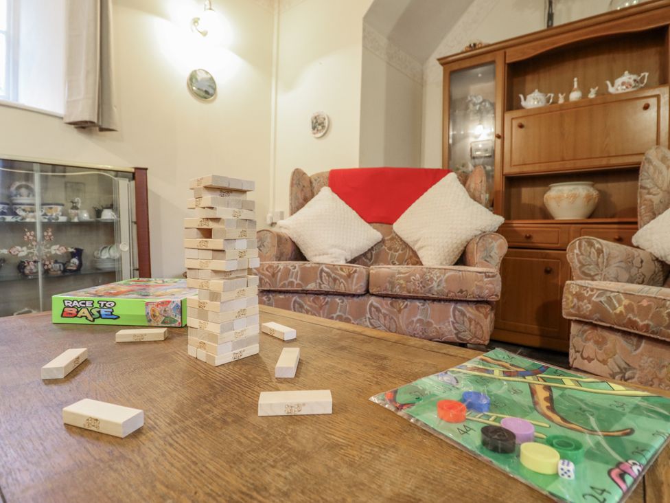 A living room with a block tower and board game at Cynfal Fawr Near Blaenau Ffestiniog