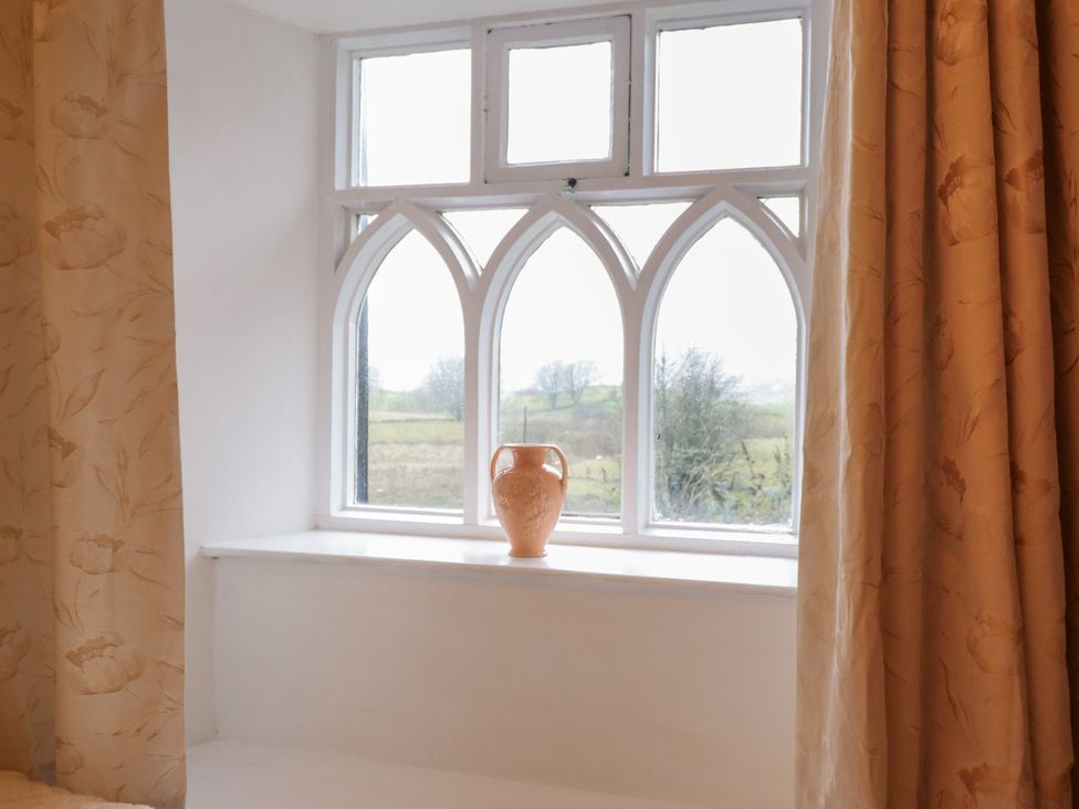A window with a vase on the sill at Cynfal Fawr Near Blaenau Ffestiniog