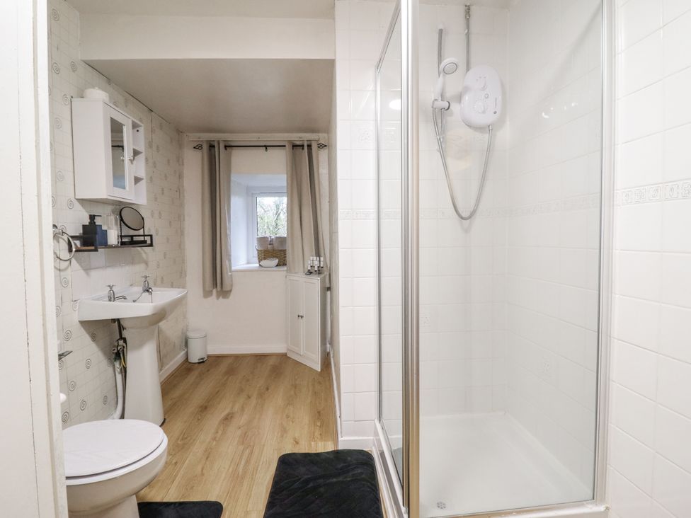 A bathroom with a shower and sink at Cynfal Fawr Near Blaenau Ffestiniog