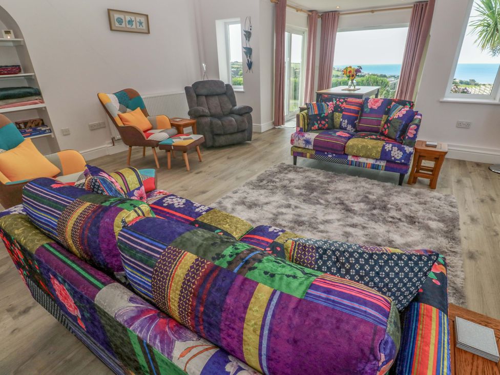 A living room with sofas and a view at St Marys in Penzance