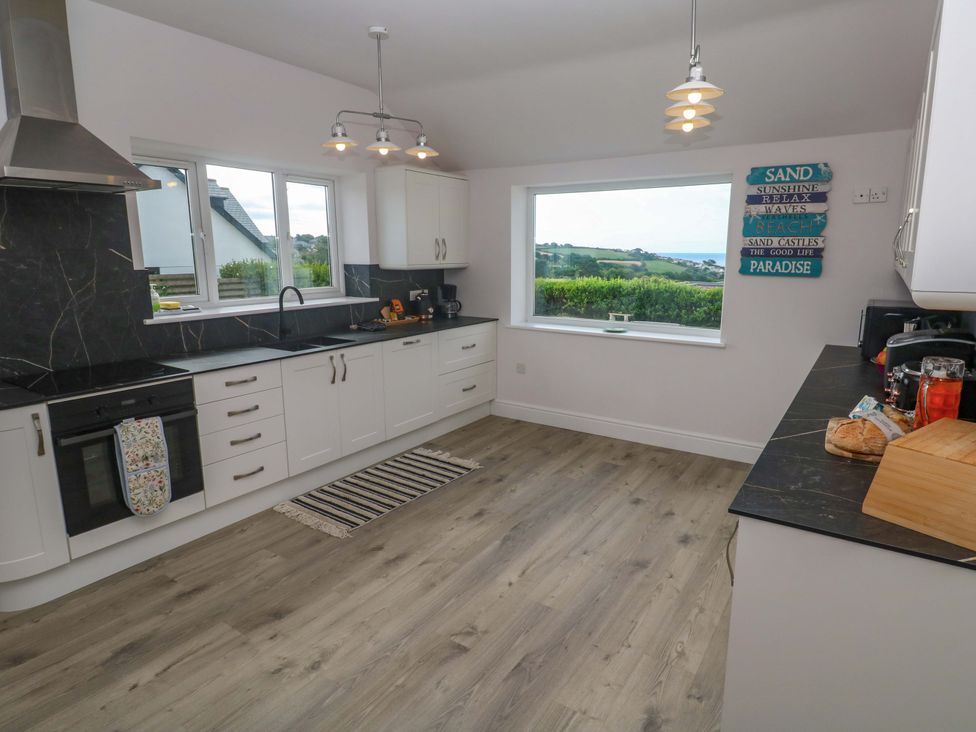 A kitchen with windows and a stove at St Marys in Penzance