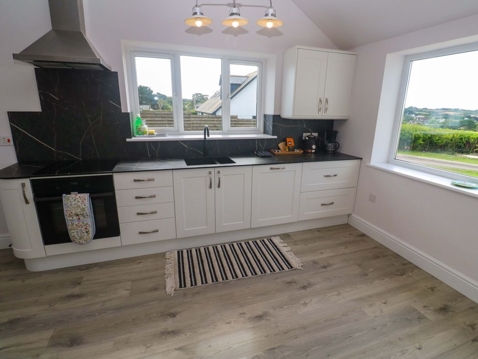 A kitchen with cabinets and a sink at St Marys in Penzance