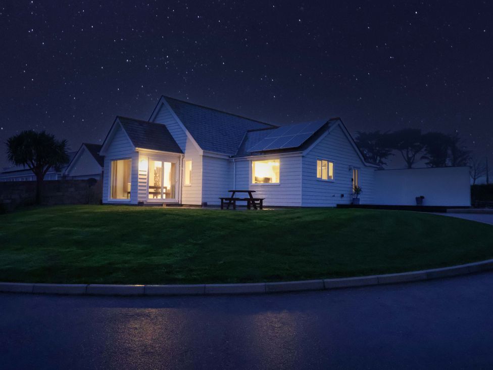A house with solar panels and a grassy area at St Marys in Praa Sands