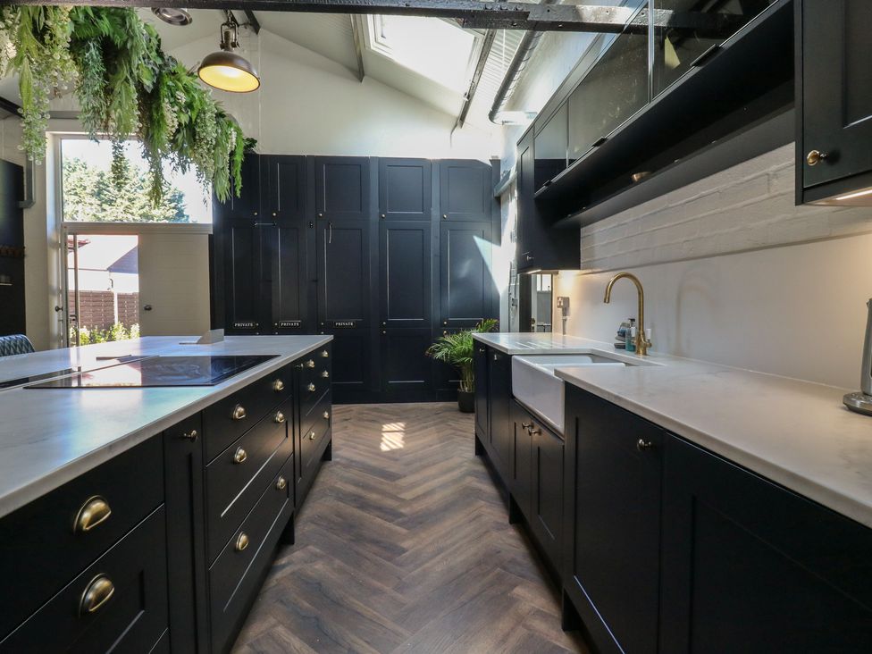 A kitchen with cabinets, sink, and countertop at The Old Workshop in Wormshill near Harrietsham