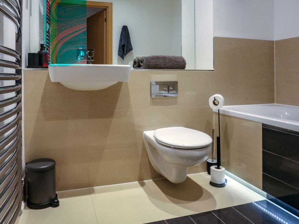 A bathroom with toilet and sink at Whitstable Bay Getaway in Whitstable