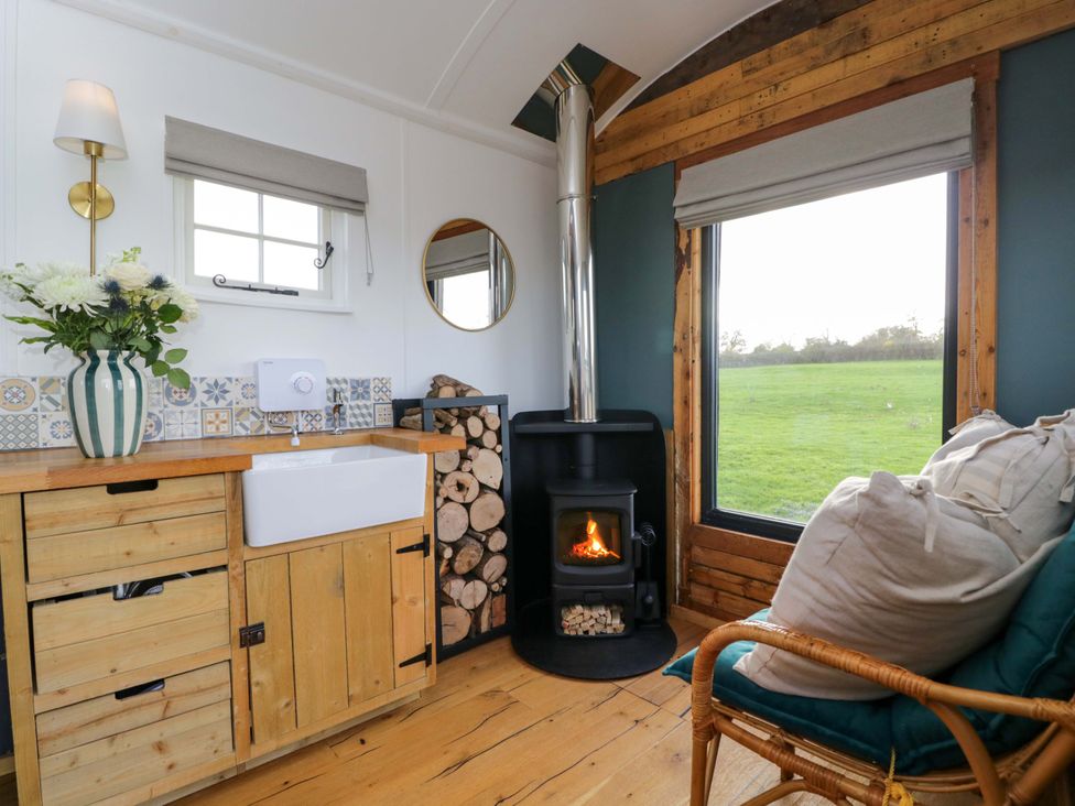 A kitchen with a sink and stove at Wiltshire Weavers Hut Sutton Benger near Christian Malford