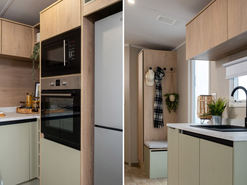 A kitchen with appliances and storage at Arlington 40 x 14 Two Bed